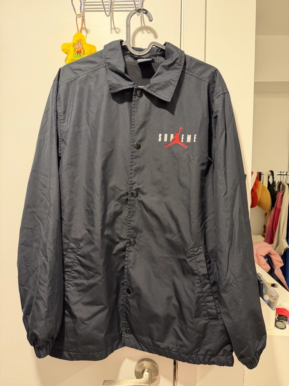 Supreme Black Coach Windbreaker with Red Logo